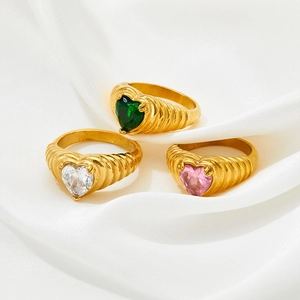 Three-piece heart zircon ring set with retro ribbed gold bands on white silk