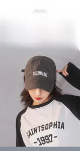 Detail of dark grey cotton baseball cap featuring white 3D Colorado embroidery