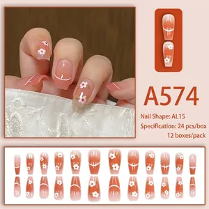 Peach gradient press-on nails with white flower accents and minimalist lines, 24pcs set