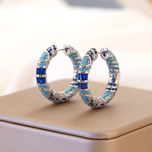 Vintage silver hoop earrings featuring blue zircon and turquoise in a retro texture