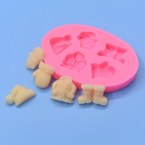 Pink silicone mold for Christmas theme DIY cake decor with Santa hat and boots shapes
