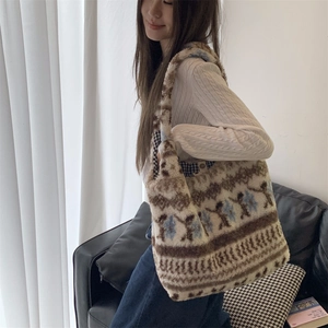 Close-up of fluffy plush tote bag featuring ethnic patterns and checkered inner lining