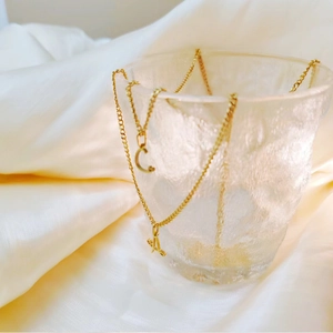 Dainty golden stainless steel initial necklaces with letter A and C pendants for women