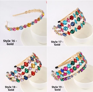 Detail of four colorful rhinestone headbands with gold alloy base in vintage baroque style