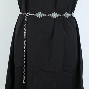 Close-up of silver waist chain with turquoise diamond charms and dangling ball detail