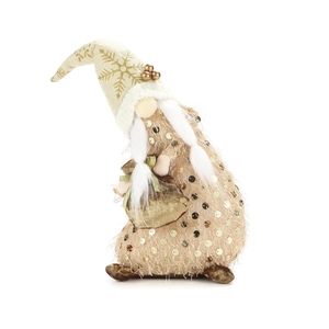 Detailed view of a Christmas gnome doll with gold sequins and snowflake patterns