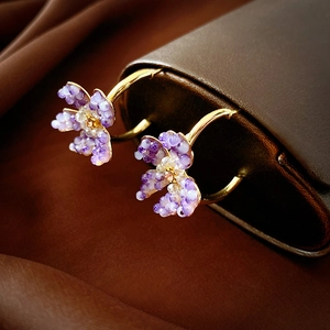 Elegant purple crystal flower hoop earrings with golden circular metal hooks for women