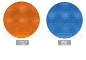 Detail view of orange and blue silicone lick pads with anti-slip dotted texture for dogs