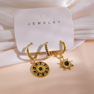 Detailed view of 14K gold plated earrings set with natural black stone on jewelry card