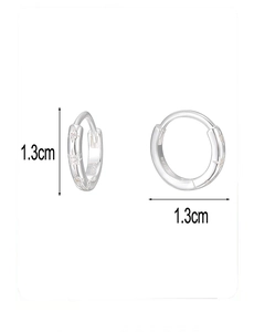 Detail of S925 sterling silver hoop earrings with star relief and 1.3cm diameter