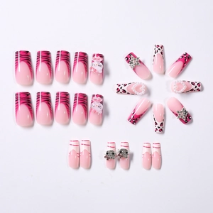 Detail of 24pcs pink and black nails with 3D cartoon charms pearls and rhinestones
