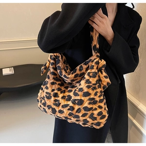 Chic quilted leopard print tote bag with knotted shoulder straps and spacious design