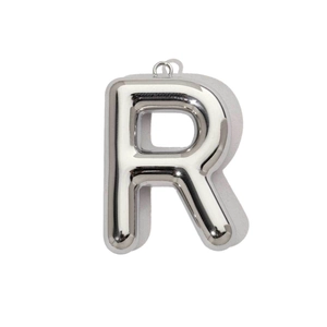 Close-up of a polished silver stainless steel hollow letter R pendant for necklaces