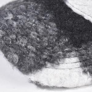Detailed close-up showing the fuzzy grey and white plaid texture of the wool baseball cap