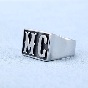 Men's silver stainless steel biker ring featuring a prominent MC engraving on a wide band