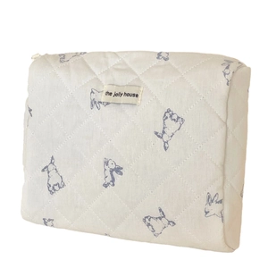 Quilted rabbit pattern cosmetic bag with blue bunny print and zipper closure