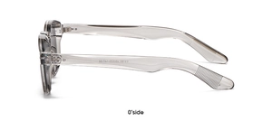 Detail view of transparent grey eyeglass frame with metal hinge and CE marking on temples