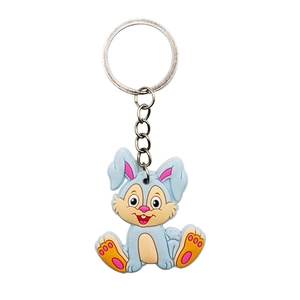 Detailed close-up of a blue cartoon rabbit keychain made of soft silicone and silver ring