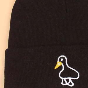 Winter black ribbed knit beanie featuring a cute white embroidered cartoon duck pattern