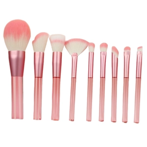 9-piece makeup brush set with pink gradient transparent handles and soft synthetic bristles