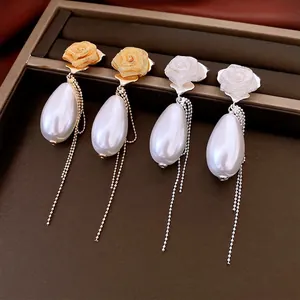 French palace style rose pearl tassel earrings in gold and silver finish