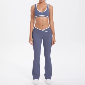Detail of blue yoga set featuring V-shaped cross high waist and white contrast piping trim