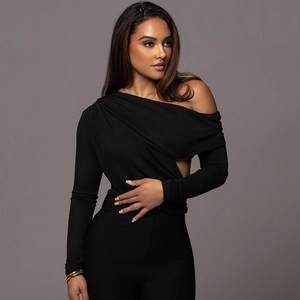 Close-up of black one-shoulder bodysuit featuring side cutout detail and elastic fabric