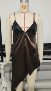 Detail of V-neck patchwork camisole dress with faux leather top and asymmetric satin hem