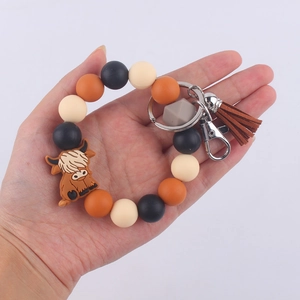Silicone highland cow beaded keychain bracelet with brown tassel and metal keyring