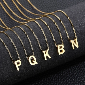 Gold stainless steel initial pendant necklaces with letters P Q K B N on black leather