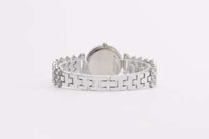 Detailed back view of silver metal watch featuring rhinestone H-link bracelet strap