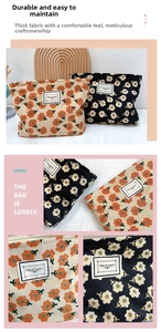 Detail view of floral corduroy makeup bags with sturdy zipper and woven label accents
