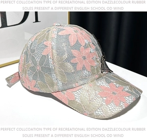 Detailed close-up of pink lace floral pattern and 3D mesh butterfly on the sun hat