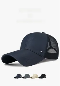 Detail of breathable mesh fabric and sport logo on a lightweight navy blue baseball cap