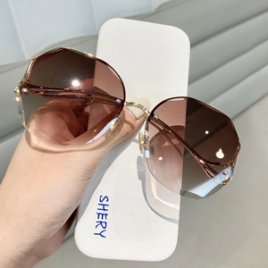Lunettes de soleil sans monture à verres dégradés marron et branches dorées