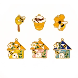 Set of 6 honey bee enamel pendants featuring honeycomb, honey jar, and hives charms