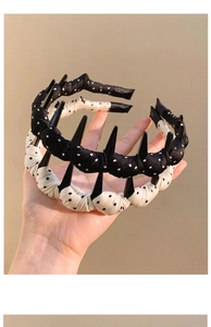 Close-up of polka dot headbands showing the inner comb teeth for a secure non-slip fit