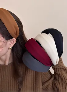 Close-up of thick vintage padded headbands in assorted autumn colors with soft knit texture