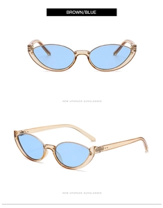 Detail view of light brown transparent cat-eye sunglasses with sky blue lenses
