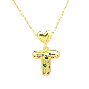 Detail of gold letter T balloon pendant with colorful zircon stones on white background
