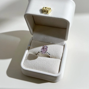 Pink oval ice flower cut zircon ring in a premium white crown jewelry gift box