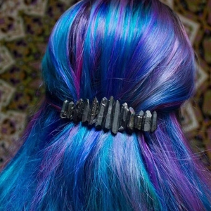 Detail of bohemian black crystal quartz spring hair clip styled on blue gradient hair