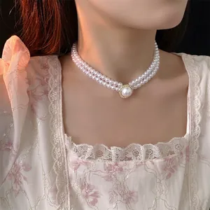 Double layered pearl necklace with diamond oval pendant and elegant French style design