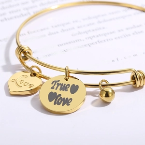 Adjustable gold stainless steel bangle with engraved Love heart and True Love round charms