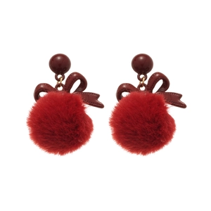 Elegant red bow and plush pompom stud earrings with silver needles on white background
