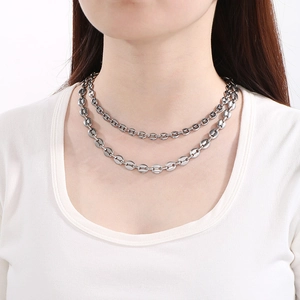 Silver double-layer coffee bean link necklace styled on a white T-shirt with clear detail