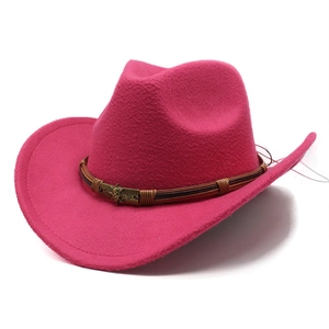 Detail of rose red wool cowboy hat with brown strap and bronze skull buckle