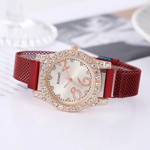 Women's rose gold quartz watch with diamond bezel and red magnetic mesh strap