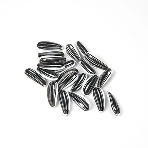 Realistic PVC sunflower seed props with black and white stripes for fun snack displays