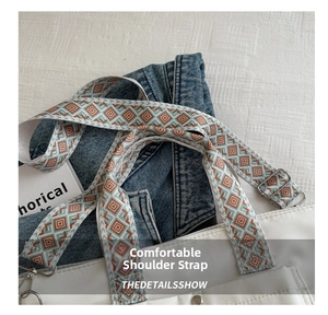 Detail of wide ethnic geometric shoulder strap with silver hooks for canvas tote bags